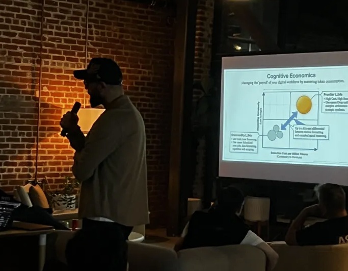 Andrew presenting on Cognitive Economics — managing token costs across your AI workforce